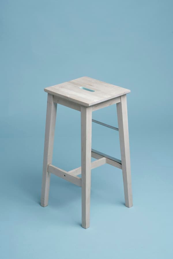 Scandinavian solid wood dining chair beside table